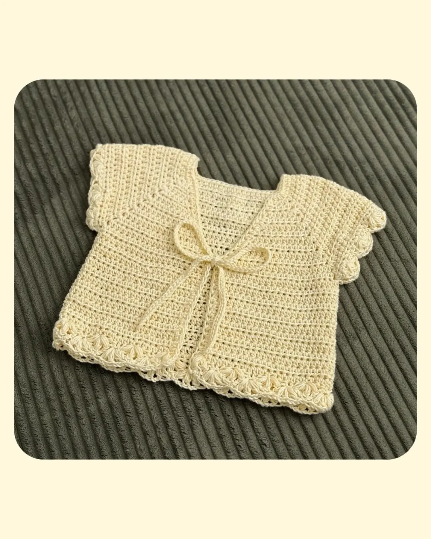 Butter-yellow Spring Lotus cardigan with scalloped sleeves and a tie front